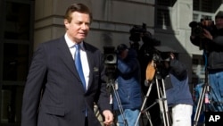 FILE - Paul Manafort, President Donald Trump's former campaign chairman, leaves the federal courthouse after his hearing in Washington, Feb. 28, 2018.