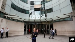 FILE - The main entrance to the headquarters of the BBC in London, Wednesday, July 19, 2017. The publicly funded BBC has published the names and salaries of its highest-earning actors and presenters, Wednesday, compelled by Britain's government to publish the salaries of on-air talent, which had previously been secret, revealing that its highest-paid star, radio host Chris Evans, earns more than 2.2 million pounds ($2.9 million) a year.