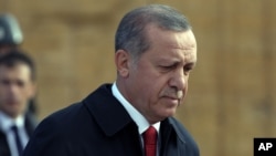 Turkish President Recep Tayyip Erdogan walks to the mausoleum of Turkey's founder Mustafa Kemal Ataturk on Republic Day in Ankara, Oct. 29, 2015.