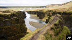 This photo taken Wednesday, May 1, 2019, shows a cliff at the Fjadrárgljúfur canyon in southeastern Iceland. (AP Photo/Egill Bjarnason)
