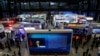 FILE - China's President Xi Jinping is shown on a screen in front of logos of China's leading internet companies during the World Internet Conference in Wuzhen town of Jiaxing, Zhejiang province, China, Nov. 17, 2016.