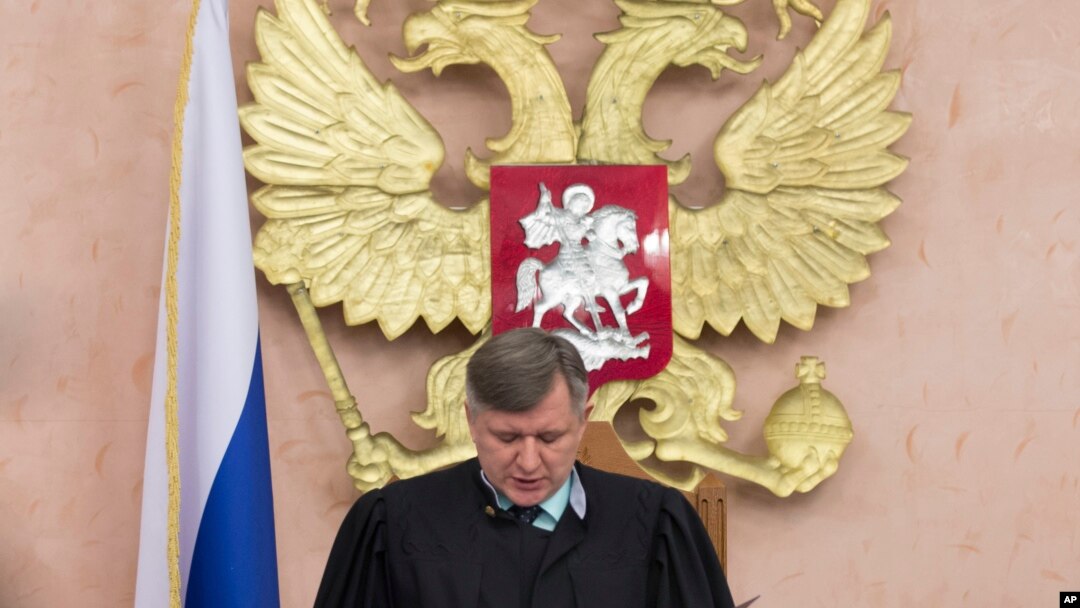 Russia's Supreme Court judge Yuri Ivanenko reads the decision in a court room in Moscow, Russia, April 20, 2017. Russia's Supreme Court banned the Jehovah's Witnesses from operating in the country.