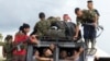 Rebels of the Revolutionary Armed Forces of Colombia, FARC, arrive in Yari Plains, southern Colombia, Sept. 25, 2016. 