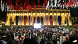 Demonstrators gather at the Parliamentary building during an opposition protest against the foreign agent bill in Tbilisi, Georgia, on Tuesday, May 28, 2024. (AP Photo/Zurab Tsertsvadze)