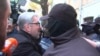 Nika Gvaramia, leader of the Coalition for Change party, is seen surrounded by police officers before his detention in Tbilisi, Georgia, Dec. 4, 2024, in this still image from video. 