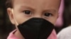 El Salvador registra 6.438 contagios y 174 fallecimientos, a causa de la pandemia del coronavirus. En la foto Gael Gómez, de 1 año, usa una mascarilla para evitar el contagio del coronavirus. Ilopango, martes 19 de mayo de 2020.