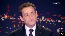 France's President Nicolas Sarkozy, seen in this video grab, formally declares his candidacy for a second term on France TF1 television prime time news program, February 15, 2012.