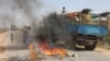 A truck passing a partial roadblock setup by residents as a protest against the Islamist Al-Shabab insurgent group, in Tobanka Buundo in the lower Shabelle region, near the Somalian capital Mogadishu, March 6, 2014.