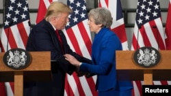 Britain's Prime Minister Theresa May and U.S. President Donald Trump attend a joint news conference at the Foreign & Commonwealth Office, in London, Britain, June 4, 2019. 