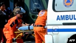 Police and employees of the Public Ministry investigate near a mass grave with seven bodies at the indigenous region of Ngabe Bugle, Panama, Jan. 15, 2020, in this screen grab taken from Panamanian channel TVN Noticias. 