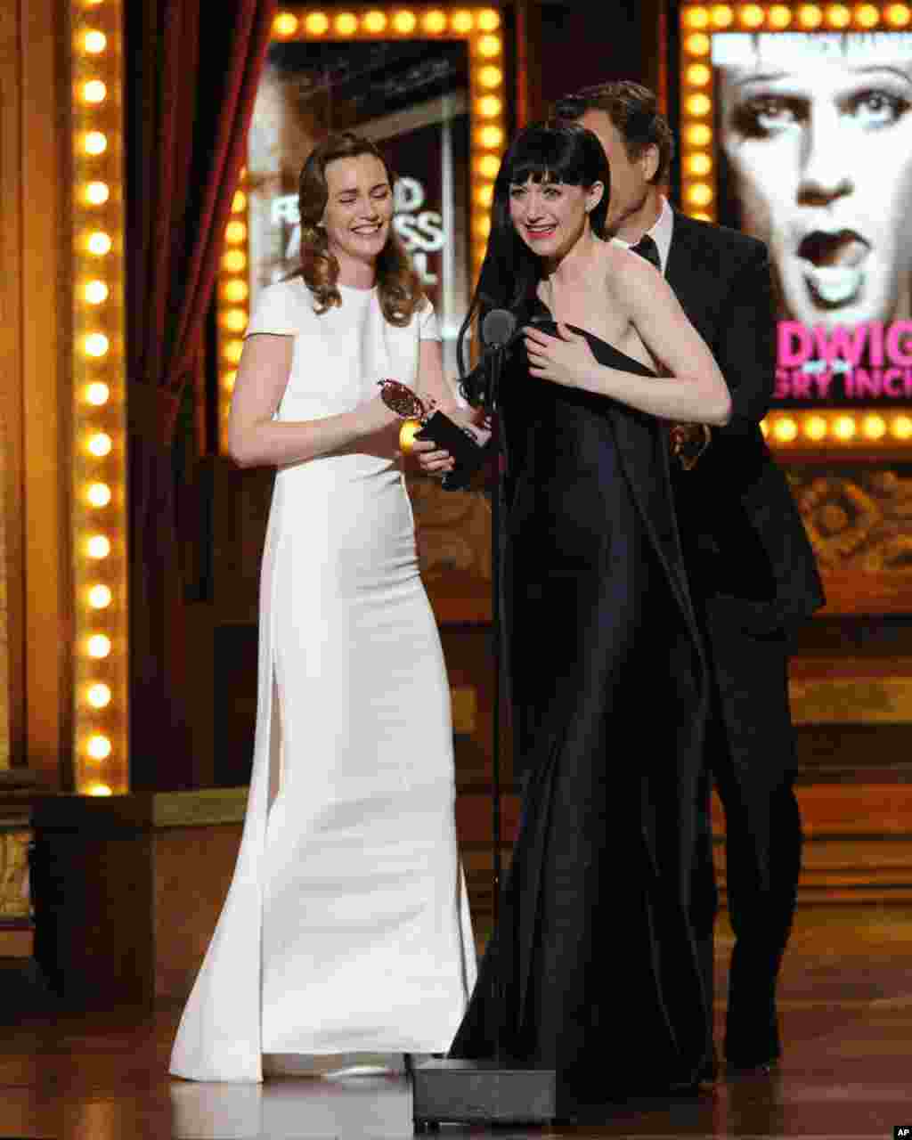 Lena Hall accepts the award for best performance by an actress in a featured role in a musical from Leighton Meester and Tony Goldwyn for "Hedwig and the Angry Inch" on stage at the 68th annual Tony Awards at Radio City Music Hall, June 8, 2014.