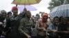 People originally from Mali's north protest in the rain against the Islamist takeover of northern Mali, in the capital, Bamako, Mali, July 4, 2012.