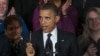 President Barack Obama holds up a pen as he speaks about the economy and the deficit in the East Room of the White House in Washington, file photo. 