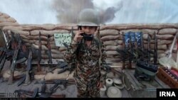This photo posted on Iran's state-run news agency site IRNA purportedly shows a child being trained to fire weapons at Iran’s perceived Western enemies.