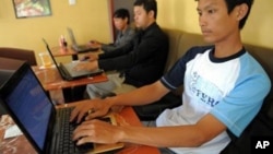 Cambodian men are using internet at a coffee shop in Phnom Penh, file photo.