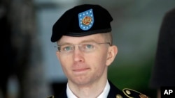 Army Pvt. Chelsea Manning, then-Army Pfc. Bradley Manning, is escorted out of a courthouse in Fort Meade, Md., after the third day of his court martial.