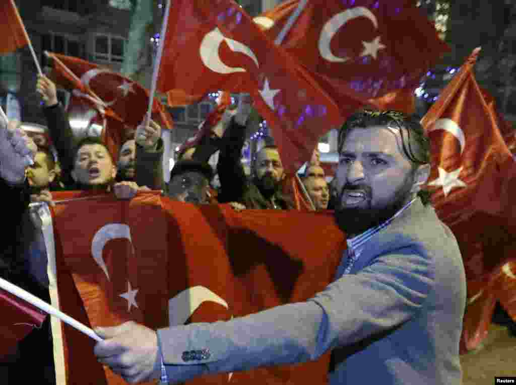 Demonstrators gather to welcome the Turkish Family Minister Fatma Betul Sayan Kaya, who decided to travel to Rotterdam by land after Turkish Foreign Minister Mevlut Cavusoglu's flight was barred from landing by the Dutch government, in Rotterdam, Netherla