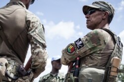 A member of the close protection unit for Central African Republic (CAR) President Touadera, composed by Russian private security company operatives from Sewa Security, are seen in Berengo, CAR on August 4, 2018.