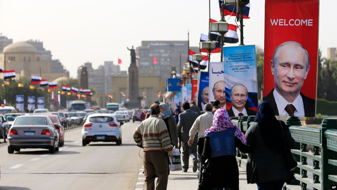 Posters of Russian President Vladimir Putin hang on light poles on Qasr El Nile Bridge in Cairo, Egypt, Feb. 9, 2015.