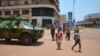 An armoured vehicle of of the Congolese army, part of the Central African Multinational Force is parked in front of a bank in central Bangui on April 3, 2013. 
