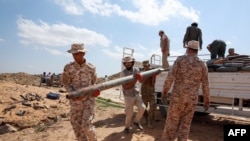 Military engineers of the U.N.-recognized Libyan Government of National Accord (GNA) arrive at the site where ammunition will be disposed in the Libyan capital Tripoli on October 12, 2020. (Photo by Mahmud TURKIA / AFP)