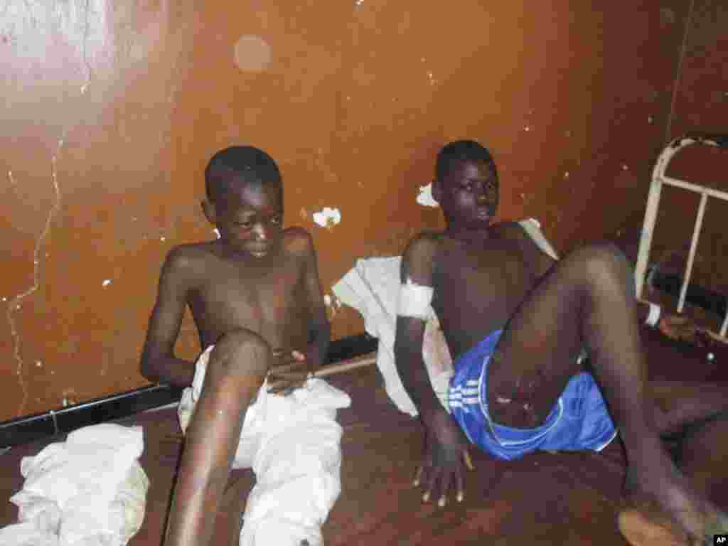 People are given medical care in the hospital following a suicide bomb attack at Government Science Technical College, in Potiskum, Nigeria, Nov. 10, 2014.