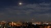 In this photo released by the Syrian official news agency SANA, shows missiles flying into the sky near international airport, in Damascus, Syria, Jan. 21, 2019