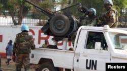FILE - U.N. peacekeepers patrol a street in Bangui, the capital of Central African Republic, Dec. 30, 2015. A U.N. contingent was sent home in early 2016 from the Central African Republic following allegations of abuse.
