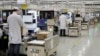 FILE - Employees work at a mobile phone production line at a Huawei factory in Shenzhen city, in southern China's Guangdong province, Jan. 15, 2019.