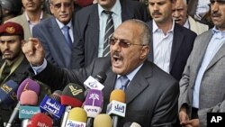Yemeni President Ali Abdullah Saleh reacts while delivering a speech to his supporters, during a rally in his support in Sana'a, Yemen, May 20, 2011.