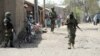FILE - Nigerian soldiers are seen patrolling Baga, a town in the northeastern state of Borno, April 30, 2013.