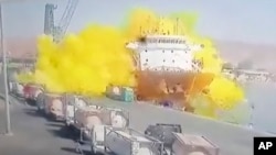 This photo taken from CCTV video broadcast by Al-Mamlaka TV shows the explosion of a chlorine gas container in the port of Aqaba, Jordan, June 27, 2022.