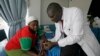 Dr. Aron Sikuku, right, explains family planning options to Beatrice Ravonga in Nairobi, Kenya. (Jan. 29, 2009 file)