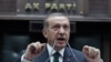 urkish Prime Minister Recep Tayyip Erdogan addresses his Islamic-rooted party in parliament in Ankara, Turkey, Tuesday, June 25, 2013. Turkish police held 20 people allegedly involved in violent protests, as Erdogan a financial claimed a conspiracy to harm Turkey.