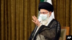 Supreme Leader Ayatollah Ali Khamenei speaks with outgoing President Hassan Rouhani's administration in Tehran, Iran, July 28, 2021, in this photo released by the official website of the office of the Iranian supreme leader.