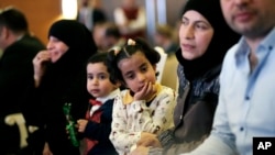 Syrian refugees attend the launch of an education program in Ankara, Turkey, June 8, 2017. 