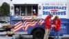 Young people are joining the efforts to deliver free food and drink to voters waiting in long lines at the polls, Oct. 29, 2020 in Charlotte, N.C. 