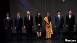 FILE - Japan's Prime Minister Shinzo Abe stands for photo with fellow Southeast Asian leaders at the 31st ASEAN Summit, in Manila, Philippines, Nov. 13, 2017. 