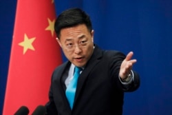 FILE - Chinese Foreign Ministry spokesman Zhao Lijian speaks during a daily briefing at the Ministry of Foreign Affairs in Beijing, Feb. 24, 2020.