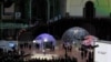 On sidelines of AI Summit in Paris, unions denounce its harmful effects 