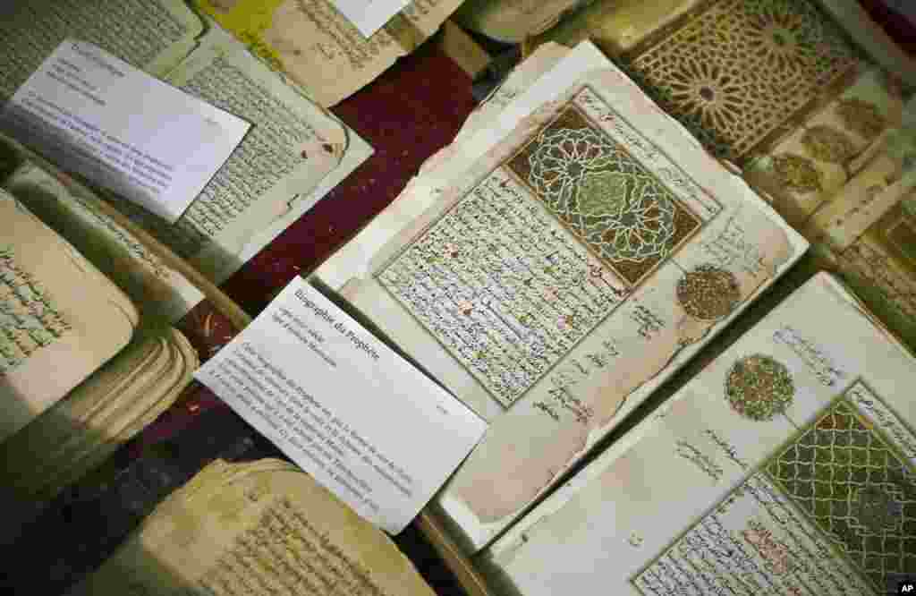 This March 16, 2004 shows some of the 20,000 preserved ancient Islamic manuscripts which rest in air-conditioned rooms are displayed at the Ahmed Baba Institute in Timbuktu, Mali.