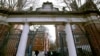 FILE - In this Dec. 13, 2018, photo, student walk on the Harvard University campus in Cambridge, Massachusetts.