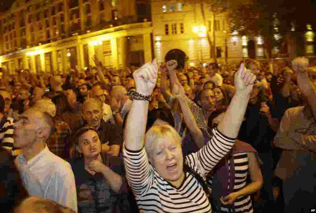 Opposition supporters reacts on the central square during a rally in Tbilisi, Georgia, October 1, 2012.