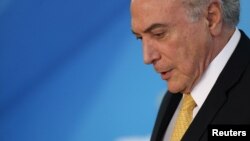 Brazil's President Michel Temer attends a meeting with trade unionists at the Planalto Palace in Brasilia, Brazil, Sept. 12, 2017.