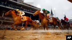 Flavien Prat rides Country House, left, to victory in the 145th running of the Kentucky Derby at Churchill Downs, May 4, 2019, in Louisville, Ky. Code of Honor, right, finished second. Luis Saez on Maximum Security finished first but was disqualified.