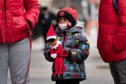 Jayceon Melendez arrives at P.S. 134 Henrietta Szold Elementary School, Dec. 7, 2020, in New York.