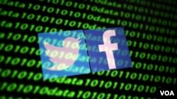 Los logos de Facebook y Twitter aparecen junto a un código binario en esta ilustración de noviembre del 2019.