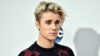 Justin Bieber arrives at the American Music Awards at the Microsoft Theater, Nov. 22, 2015, in Los Angeles. 