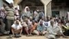 FILE - Somalis come onto the street after the government and AU troops drove al-Shabab militants from Bulomarer, in the Lower Shabelle region of Somalia, Aug. 31, 2014. Joint forces now have captured Bariire, a militant base near Mogadishu.