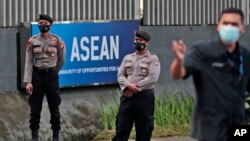 Police officers stand guard outside the Association of Southeast Asian Nations (ASEAN) Secretariat ahead of a leaders' summit to discuss Myanmar on Saturday in Jakarta, Indonesia, April 23, 2021.